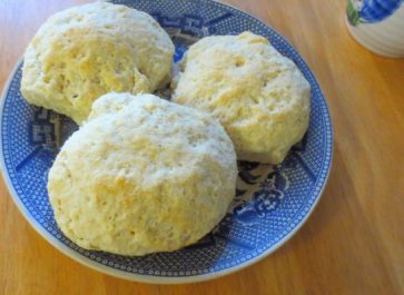 homemade biscuits on a blue willow saucer