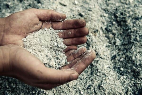 ashes in a man's hands for using wood ash