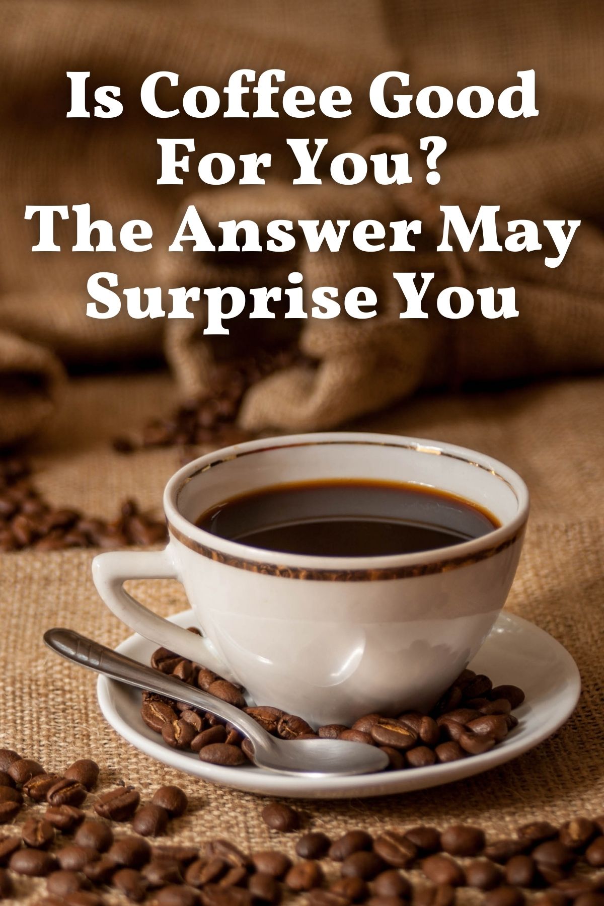 black coffee in white cup sitting on a burlap bag with coffee beans surrounding it.