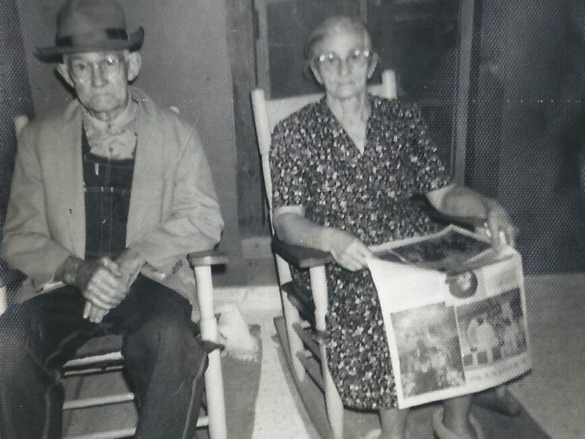 my great grandfather and great grandmother sitting on their front porch