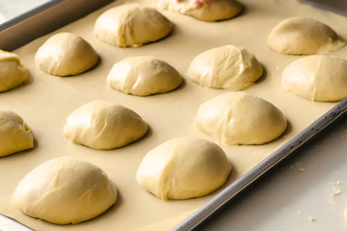 unbaked einkorn dinner rolls on a baking sheet