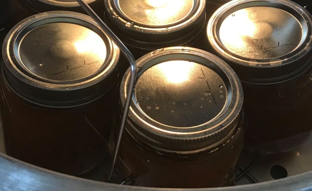 Hot water bath method for canning high-acid foods at home.