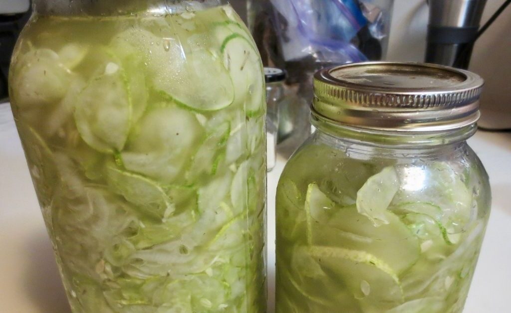Home-canned ice box pickles on kitchen counter using different canning methods