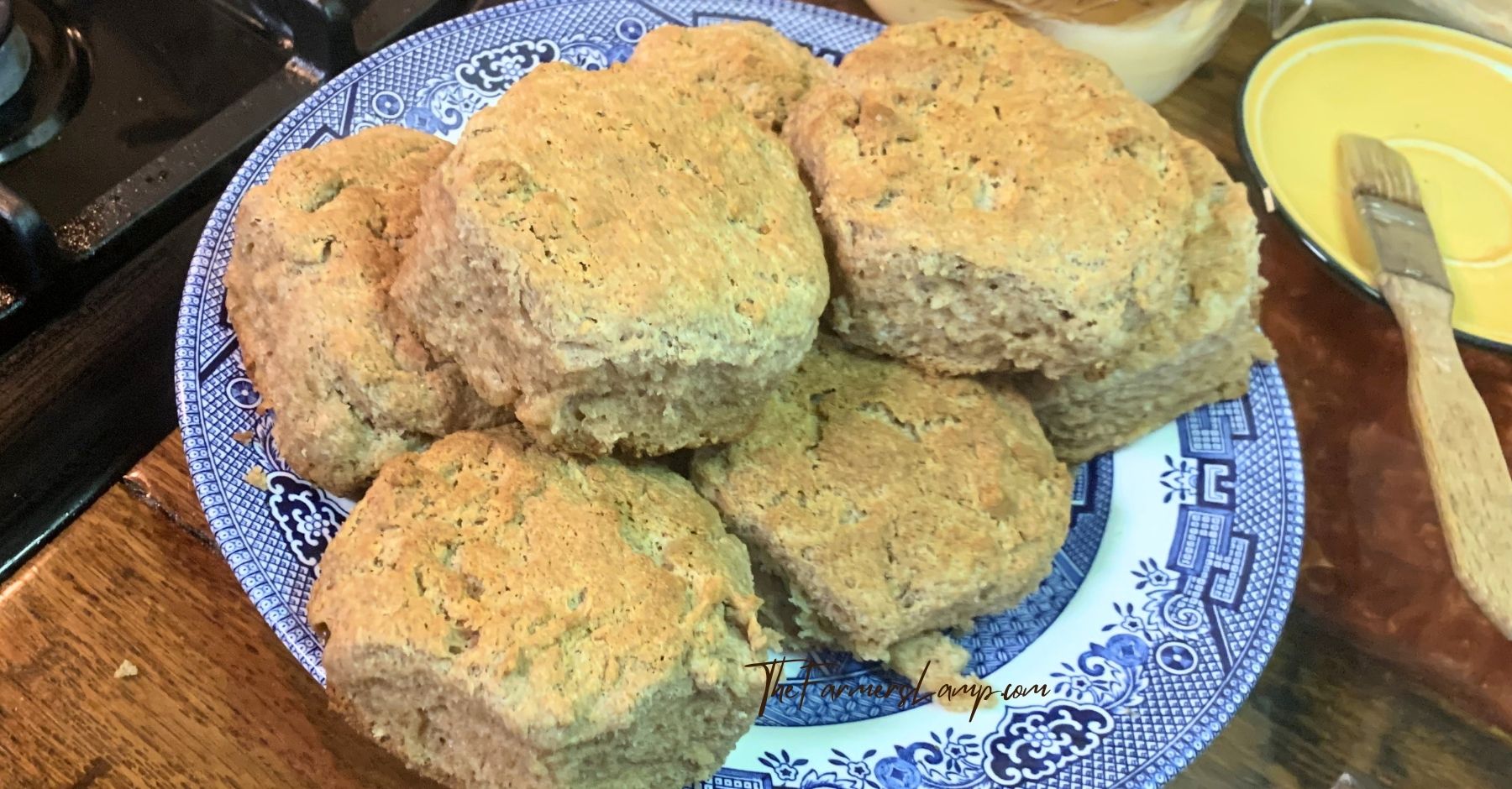 spelt flour biscuits stacked on a blue willow plate
